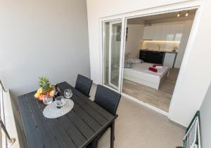 Rúm í herbergi á Seaview apartments Oscar