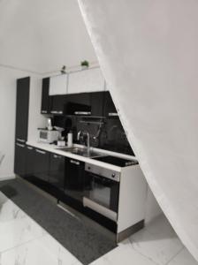 Kuchyňa alebo kuchynka v ubytovaní La casa di Titina