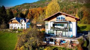 an aerial view of a house in the mountains at Wolfgangsee Appartment in St. Wolfgang