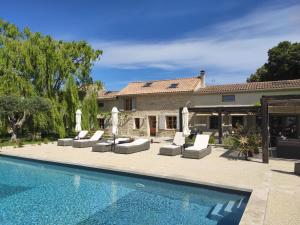 a villa with a swimming pool and a house at Les Champs de Provence in La Baume-de-Transit