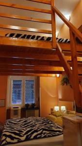 a bedroom with a loft bed with a zebra print bed at "hotel30" ROOMS in the centrum -free garage parking in Budapest