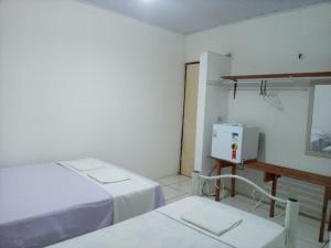 Postel nebo postele na pokoji v ubytování Chacara Cabana dos Lagos