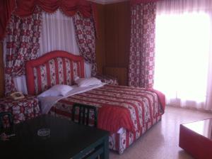 Postel nebo postele na pokoji v ubytování Residence Boujaafar