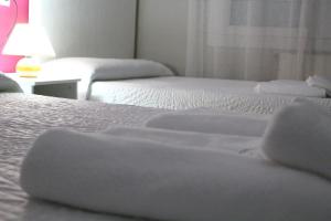 Cama o camas de una habitación en PR Navia