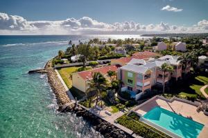 an aerial view of a resort next to the ocean at Eden blue mer et piscine in Sainte-Anne