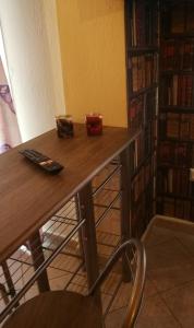 a desk in a room with a book shelf at Iliana's house in Naousa Imathias