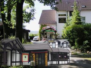 a model of a house in front of a building at Hotel Garden in Bautzen