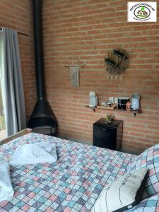 Posteľ alebo postele v izbe v ubytovaní Chalé Recanto Nosso Lar