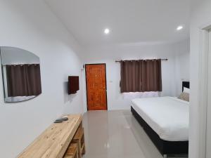Postel nebo postele na pokoji v ubytování Vamin Resort Chiangkhan Loei วามินทร์รีสอร์ท เชียงคาน เลย