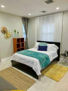 a bedroom with a large bed and a window at Central Studio in Historic Miami in Miami