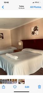Een bed of bedden in een kamer bij Denmark Hotel