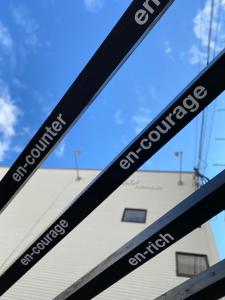 a close up of a bike frame with the words camcyclopedics on it at En- Hostel & Café bar in Amami +20 photos