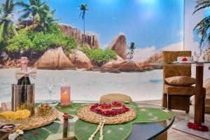 a table with a plate of food and a view of the beach at Sablotin SPA in Toulouse