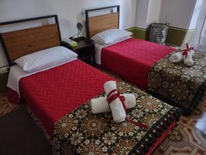 En eller flere senge i et værelse på La Tana degli Schiavoni