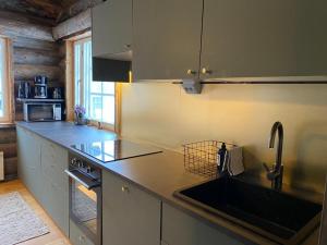 a kitchen with a sink and a counter top at Holiday Home Ruka Etelärinne 10 B in Ruka