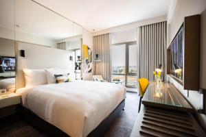 Voodi või voodid majutusasutuse Centro Mada Amman by Rotana toas