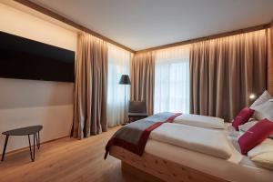 Una cama o camas en una habitación de Sonne 1806 - Hotel am Campus Dornbirn