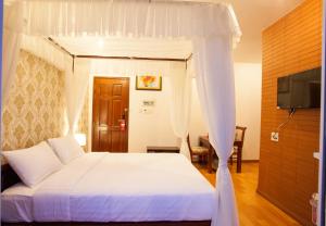 Llit o llits en una habitació de Anh Dao Mekong 2 Hotel