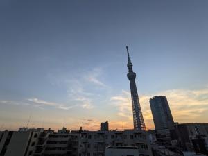 a view of a city with a tower in the background at CIEL BLEU in Tokyo