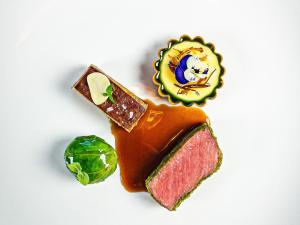 a plate of food with a sandwich and a gem at Aurora Borealis Observatory in Silsand