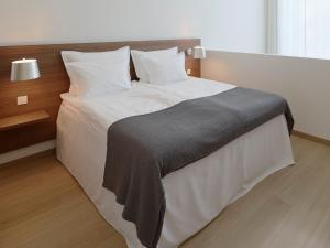 Letto o letti in una camera di PM & Vänner Hotel