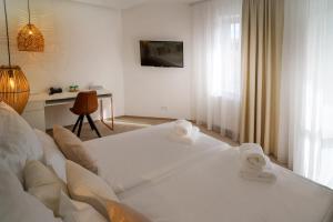A bed or beds in a room at Hotel U Kaplicky