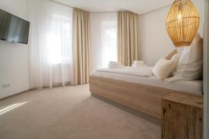 A bed or beds in a room at Hotel U Kaplicky