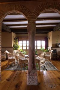 a room with chairs and a table in a building at El Camino Real in Villovela de Pirón