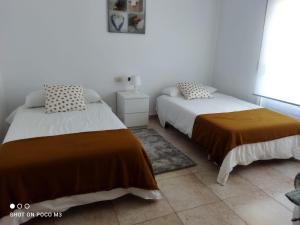 A bed or beds in a room at CASA PASAXE 1º