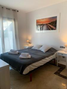 A bed or beds in a room at SEA & CASTILLO VIEW