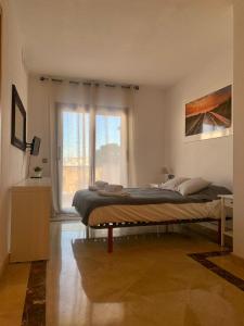A bed or beds in a room at SEA & CASTILLO VIEW