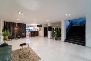 a lobby with a staircase in a building at 111Apartments in Košice