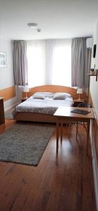 Posteľ alebo postele v izbe v ubytovaní Tailor Hotel Sport & Conference