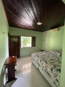 A bed or beds in a room at Casa em Alter do chão - lago verde