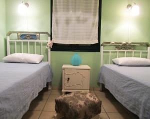 A bed or beds in a room at Polytropon Apartments