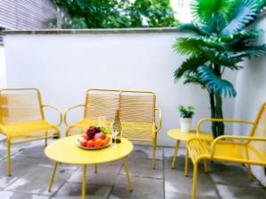 a table with a bowl of fruit on a patio at 4bd Hidden gem by Brighton Station in Brighton & Hove