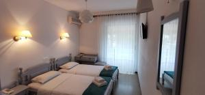 Postel nebo postele na pokoji v ubytování Hotel Rania