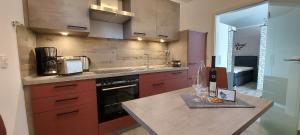 a kitchen with a counter with wine glasses on it at Moderne Ferienwohnung in Höxter an der Weser in Höxter