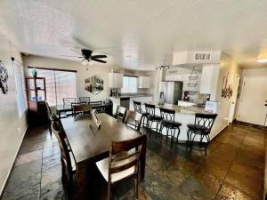 a kitchen and dining room with a table and chairs at Glendale Pool Heat Pet Friendly in Glendale