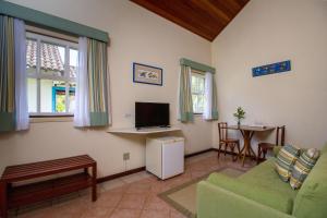 TV a/nebo společenská místnost v ubytování Villas De Paraty