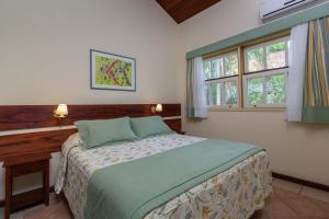 Postel nebo postele na pokoji v ubytování Villas De Paraty