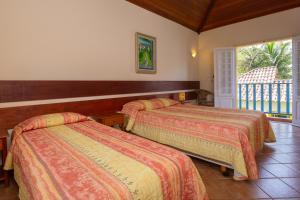 Postel nebo postele na pokoji v ubytování Villas De Paraty