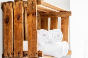 a wooden towel rack with towels at Sächsischer Hof in Meißen +62 photos