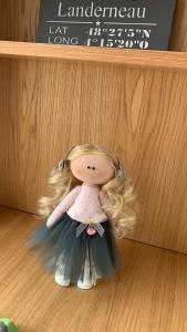 a doll is sitting in a wooden shelf at LUXURIOUS ONE BEDROOM STUDIO IN TOP CENTER in Blagoevgrad
