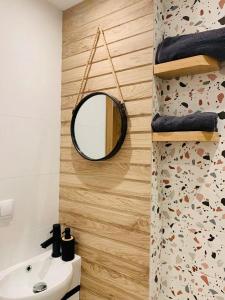 a bathroom with a mirror and a sink at LUXURIOUS ONE BEDROOM STUDIO IN TOP CENTER in Blagoevgrad