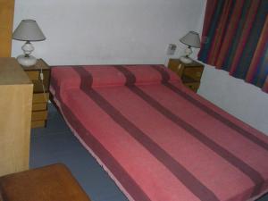 Una cama o camas en una habitación de Duplex 136 y 4