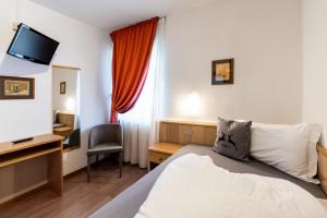 Postel nebo postele na pokoji v ubytování Albergo Dolomiti