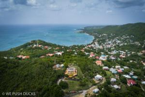 an aerial view of a town and the ocean at Belle View Apartment Villa- Lilac in Laborie