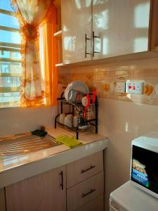 Kuchyňa alebo kuchynka v ubytovaní Amber Apartments G2 Kitengela