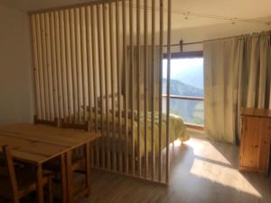 a bedroom with a bed and a table and a window at JUPILUC-PILA Studio 56 CIR 0064 in Pila
